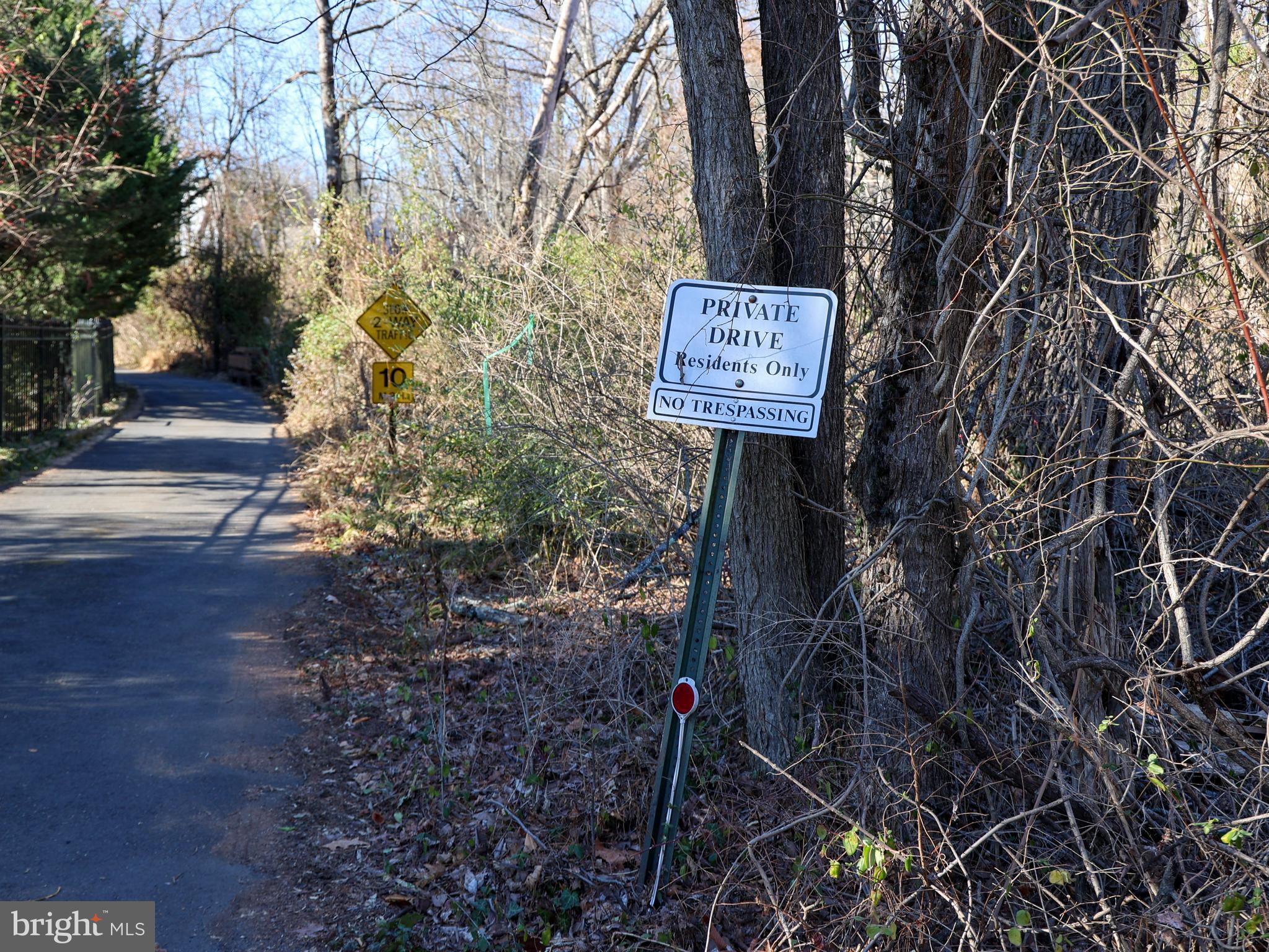 136 Red Hill Road East Princeton, NJ 08540 - Photo 16 of 17 a sign that is sitting in the middle of forest