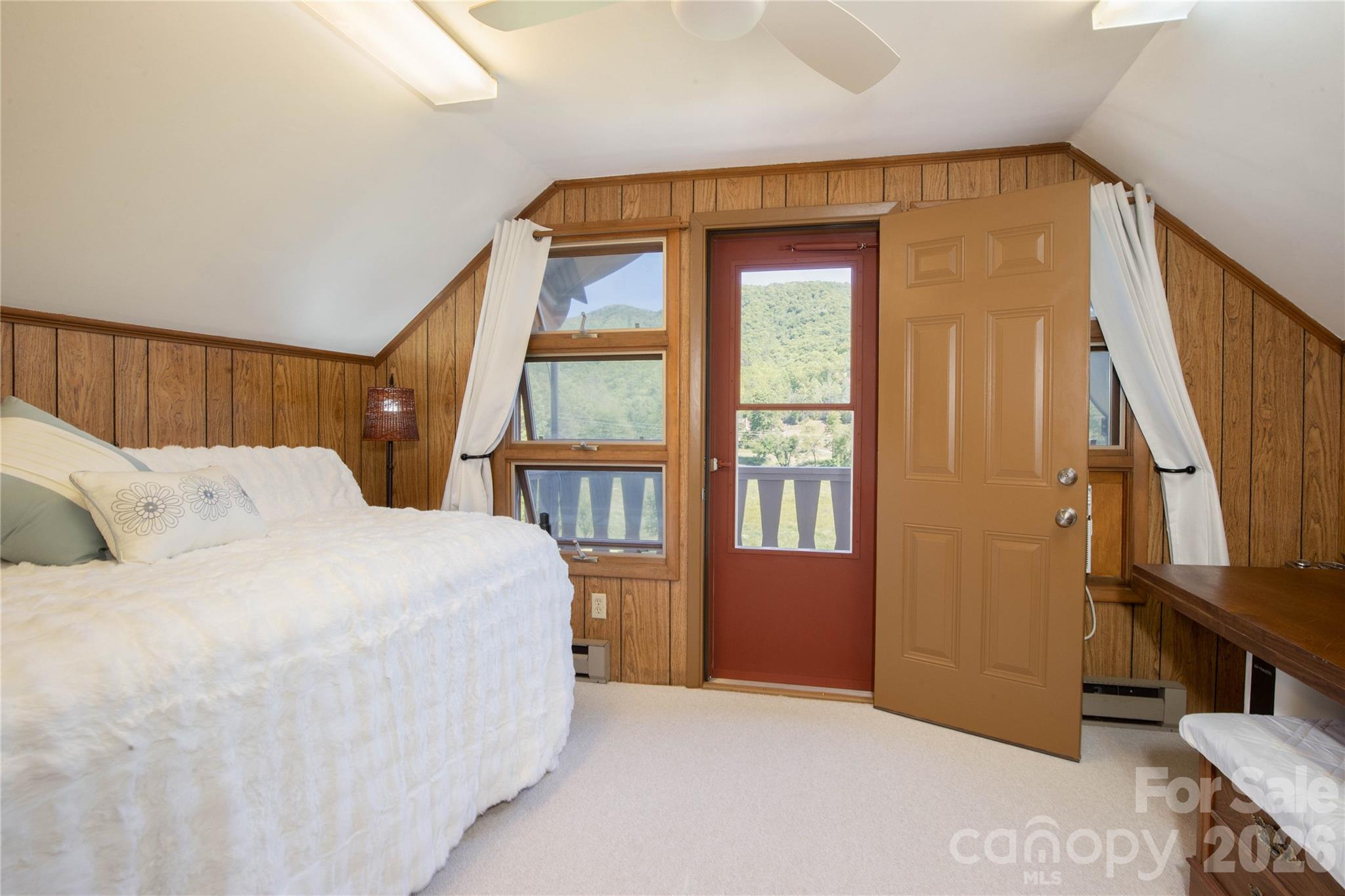93 Franklin Crest Road Spruce Pine, NC 28777 - Photo 39 of 47 a bedroom with a large bed and a window