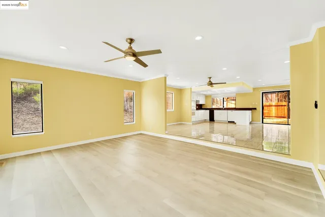 a view of a kitchen with a sink and a window
