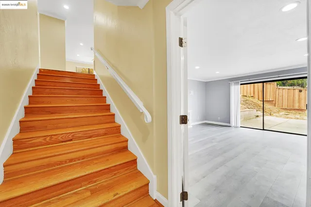 a view of a kitchen with a sink and a refrigerator