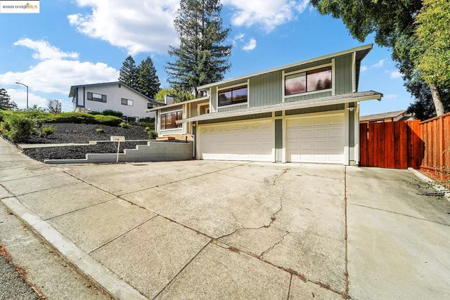 a front view of a house with a garage