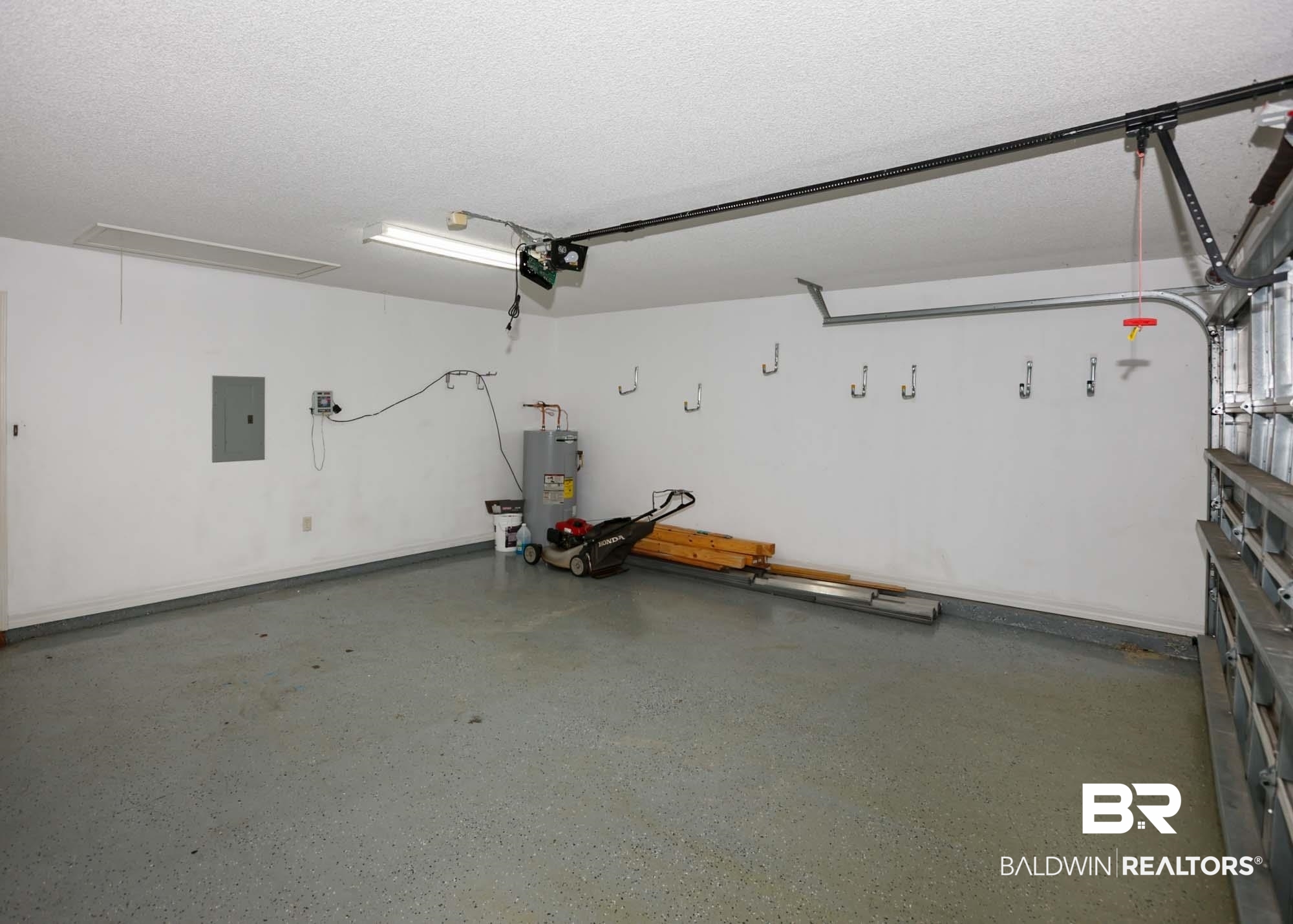2530 Ashburn Lane Foley, AL 36535 - Photo 46 of 46 Garage featuring a garage door opener, electric panel, and water heater
