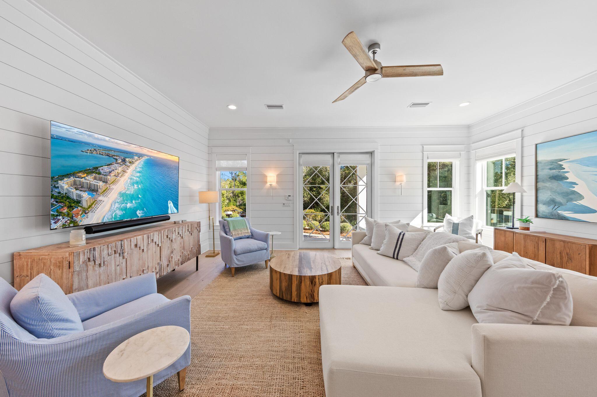 58 White Cottage Road Santa Rosa Beach, FL 32459 - Photo 24 of 84 a living room with furniture and a flat screen tv