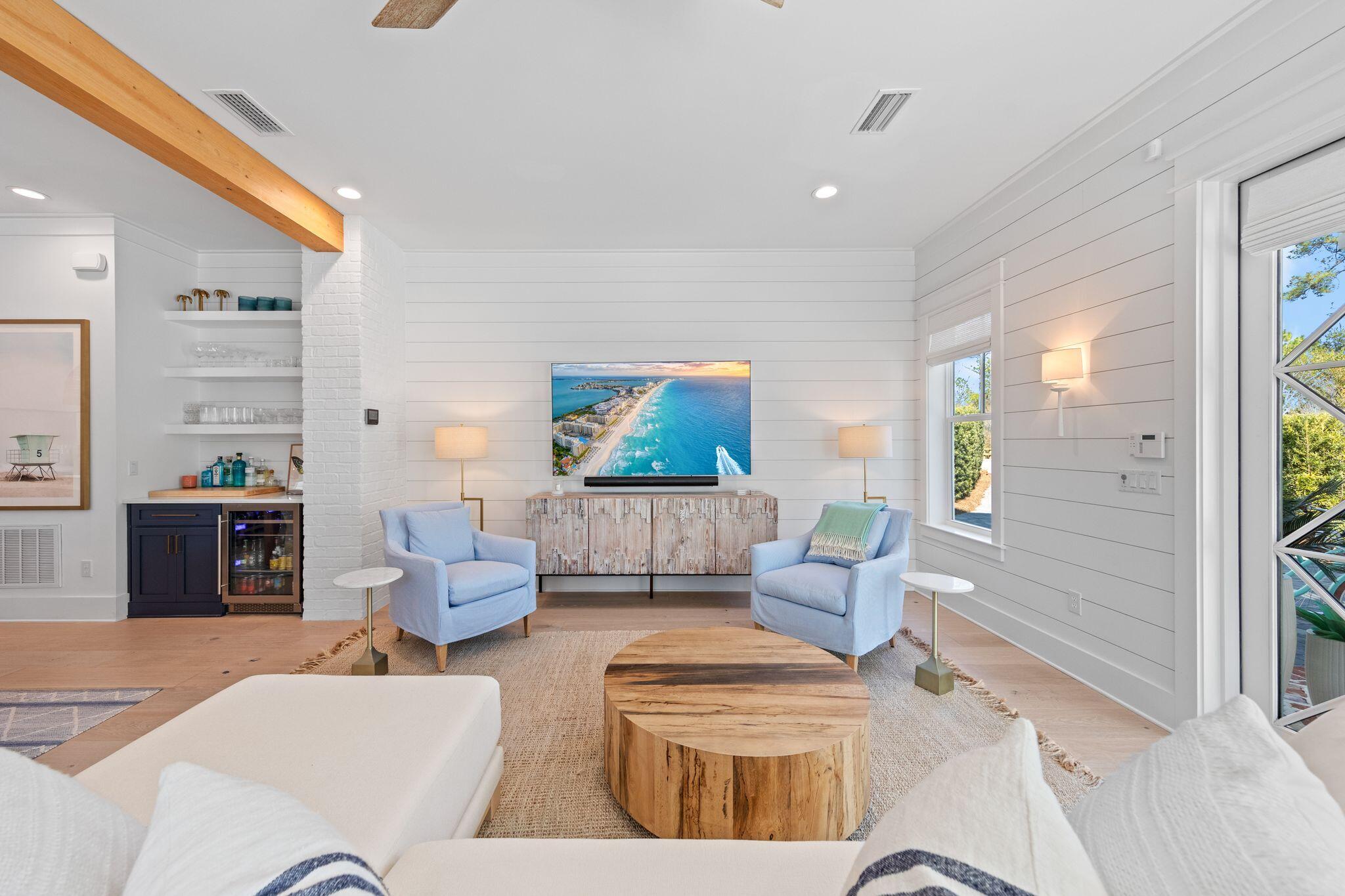 58 White Cottage Road Santa Rosa Beach, FL 32459 - Photo 25 of 84 a living room with furniture and a flat screen tv