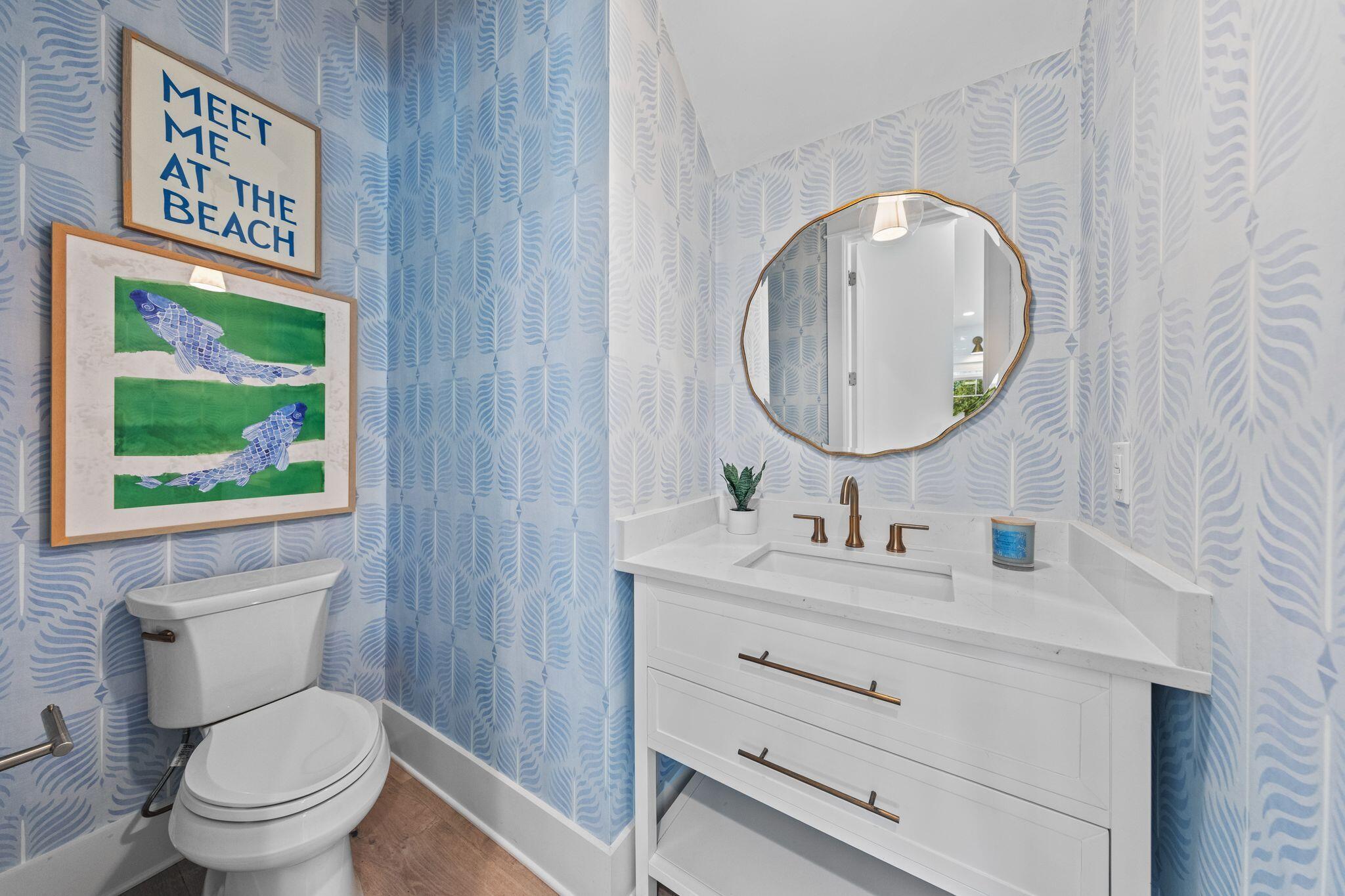58 White Cottage Road Santa Rosa Beach, FL 32459 - Photo 49 of 84 a bathroom with a toilet a sink and mirror