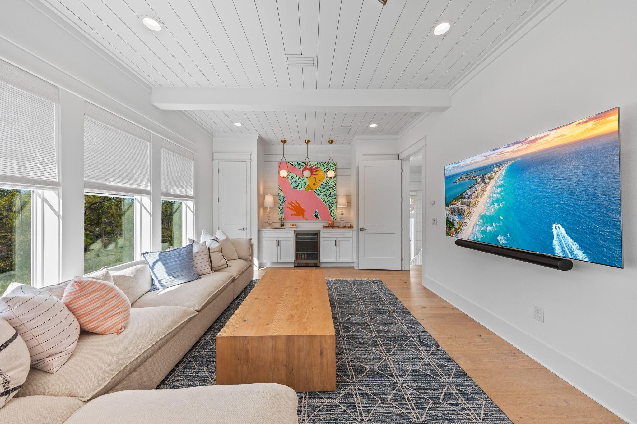 58 White Cottage Road Santa Rosa Beach, FL 32459 - Photo 53 of 84 a living room with furniture flat screen tv and a large window