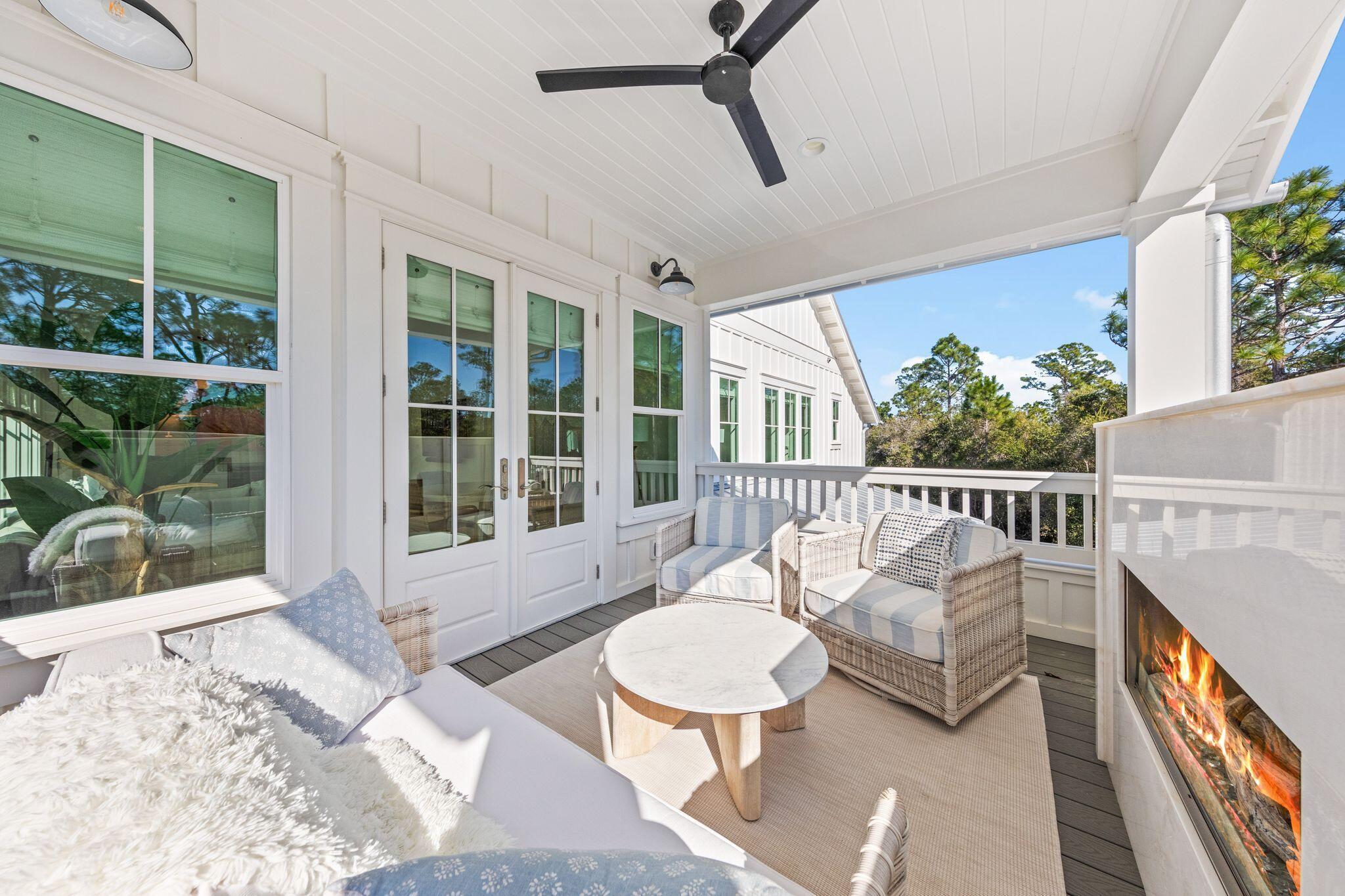 58 White Cottage Road Santa Rosa Beach, FL 32459 - Photo 57 of 84 a balcony with table and chairs