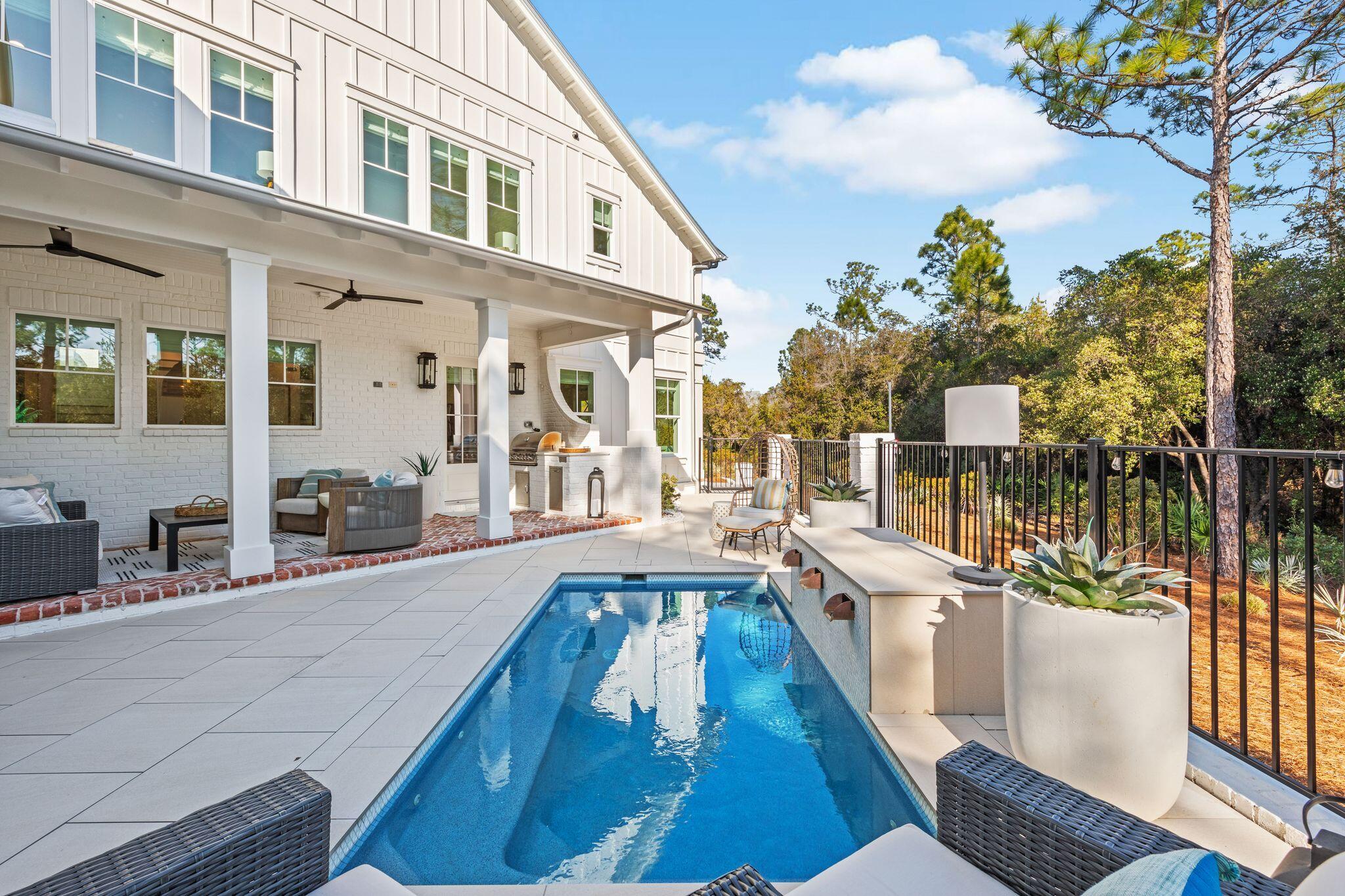 58 White Cottage Road Santa Rosa Beach, FL 32459 - Photo 6 of 84 a view of a house with swimming pool and sitting area