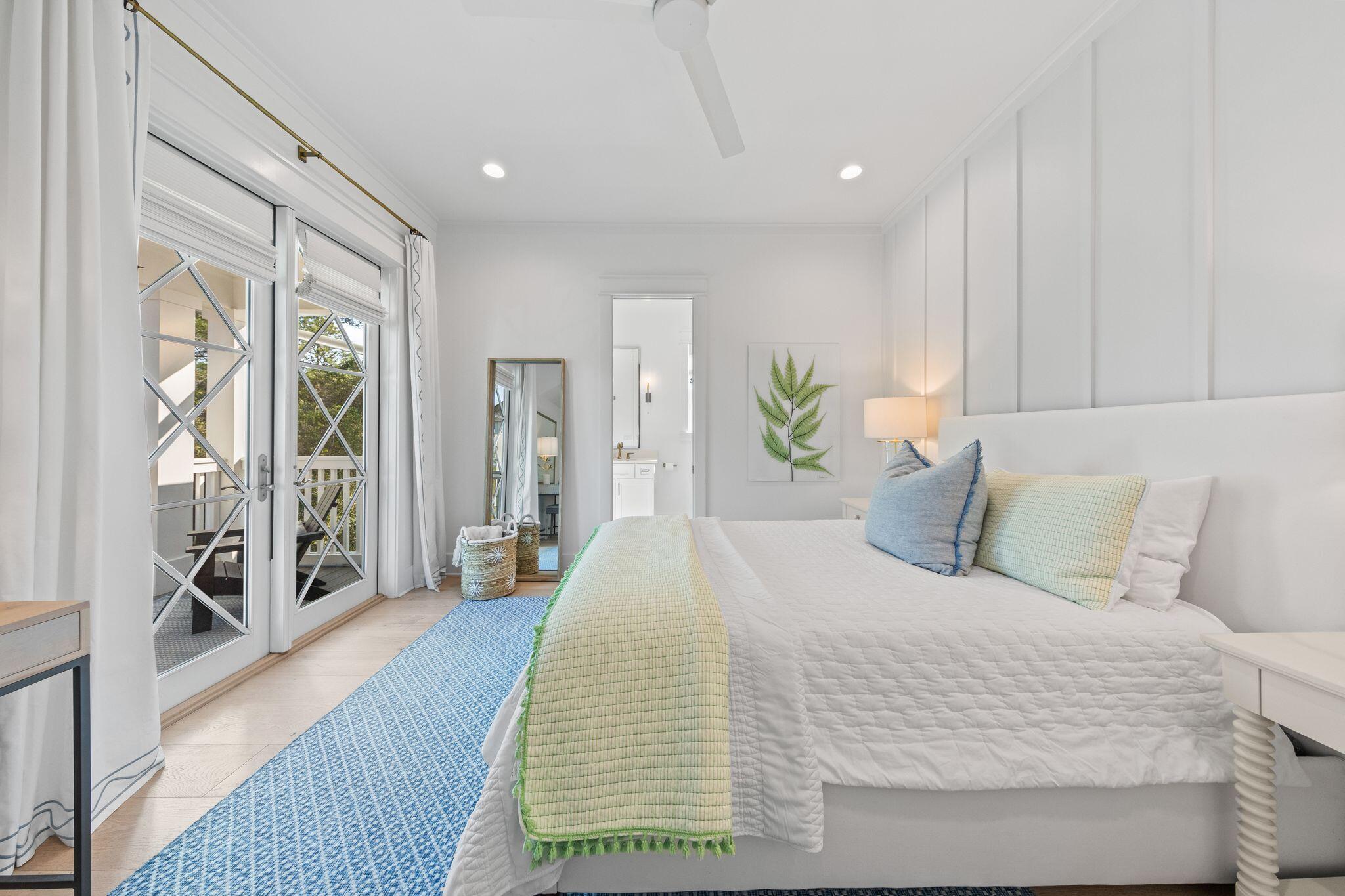 58 White Cottage Road Santa Rosa Beach, FL 32459 - Photo 69 of 84 a spacious bedroom with a large bed and a large mirror