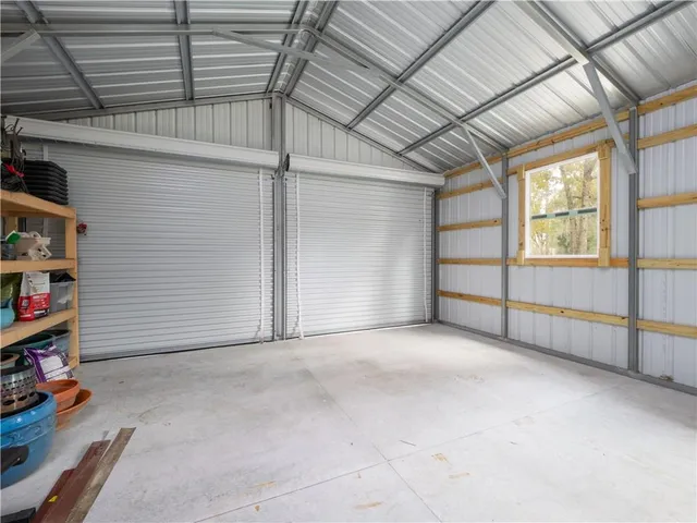 a view of an empty room with bookshelf