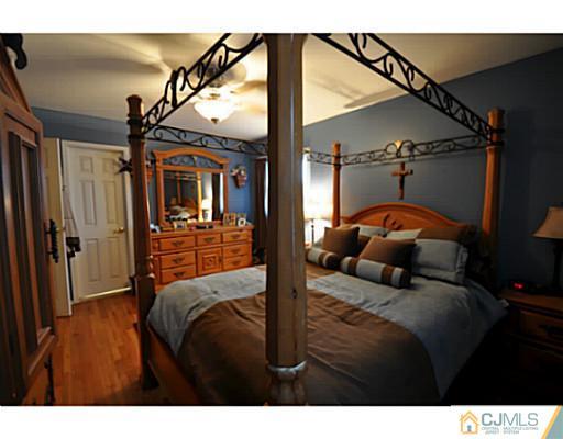 19 Barton Road Old Bridge, NJ 08857 - Photo 8 of 15 a bedroom with a bed next to a window