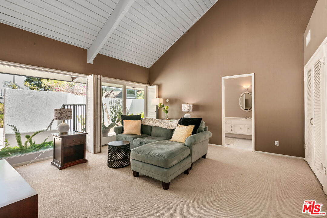 2601 Cordelia Road Los Angeles, CA 90049 - Photo 11 of 43 a living room with furniture and a large window
