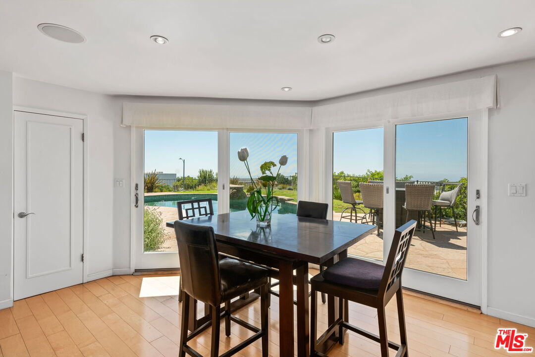 2601 Cordelia Road Los Angeles, CA 90049 - Photo 20 of 43 a dining room with furniture and wooden floor