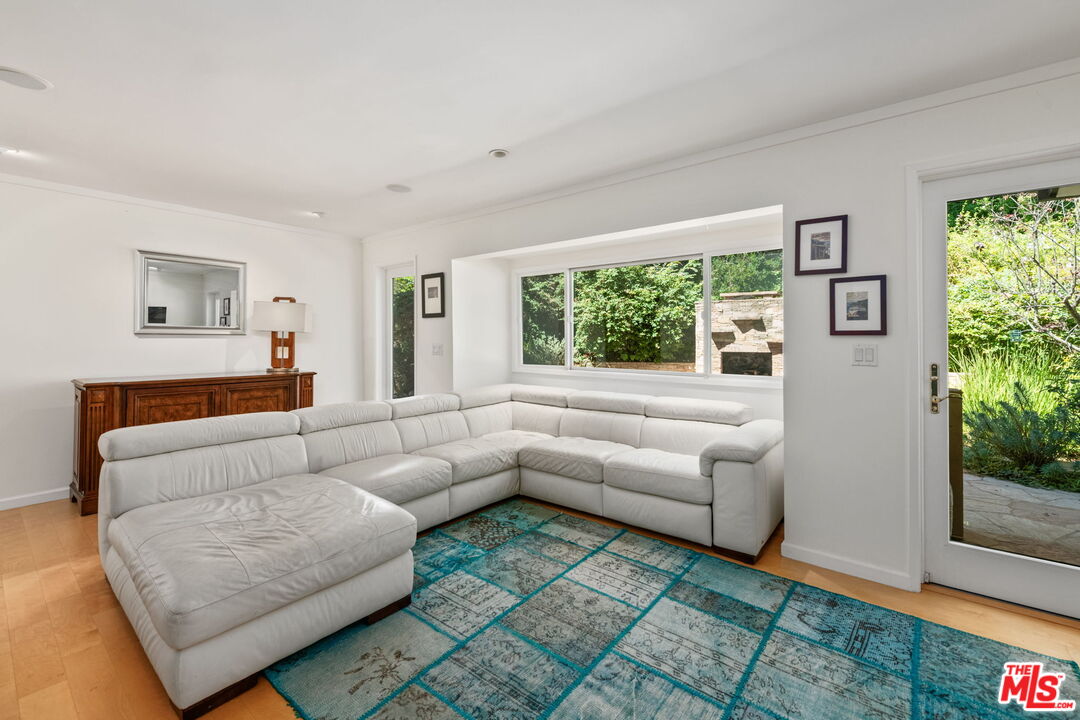 2601 Cordelia Road Los Angeles, CA 90049 - Photo 22 of 43 a living room with furniture and a large window