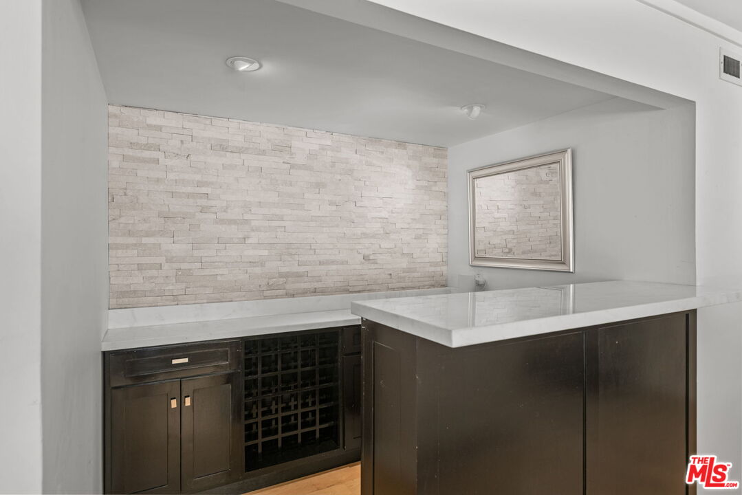 2601 Cordelia Road Los Angeles, CA 90049 - Photo 23 of 43 a kitchen with a sink and a cabinets