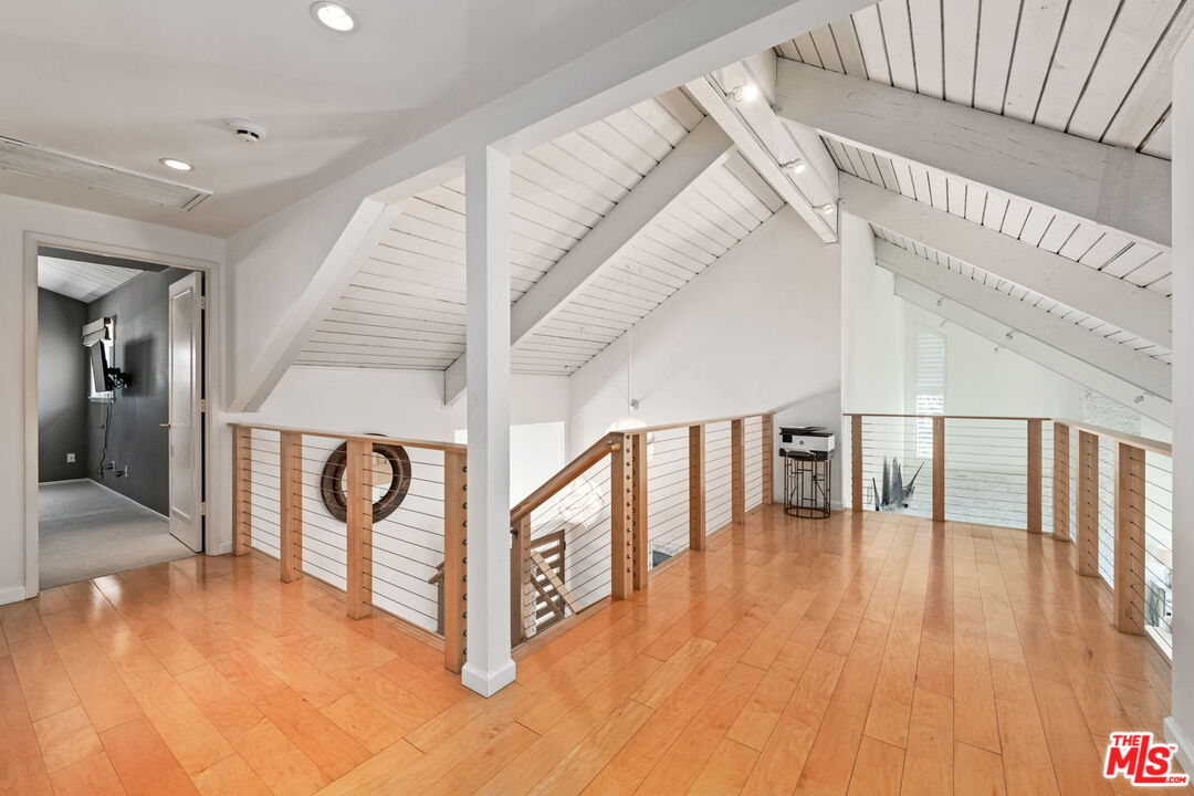 2601 Cordelia Road Los Angeles, CA 90049 - Photo 27 of 43 a view of entryway and hall with wooden floor
