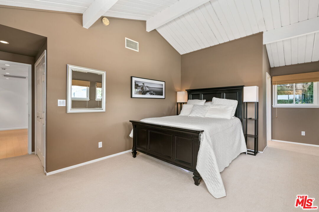 2601 Cordelia Road Los Angeles, CA 90049 - Photo 28 of 43 a bedroom with a bed and window