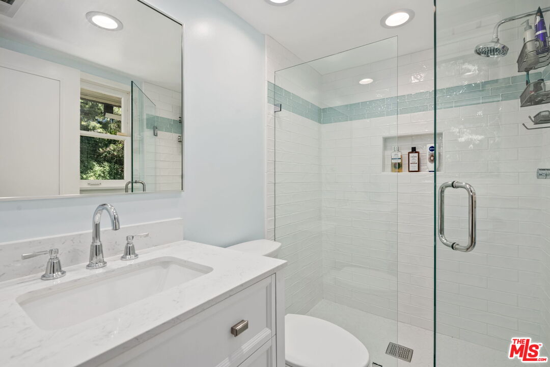2601 Cordelia Road Los Angeles, CA 90049 - Photo 29 of 43 a bathroom with a sink toilet and shower