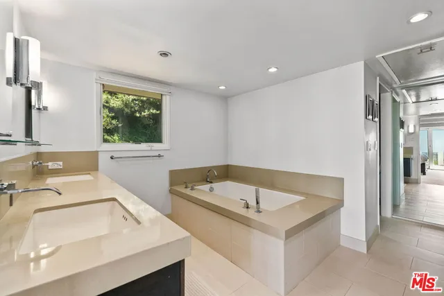 a bathroom with a sink and a bathtub
