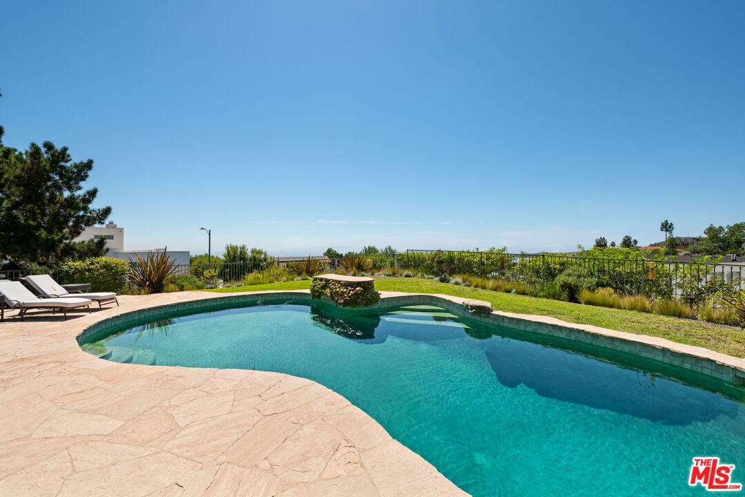 2601 Cordelia Road Los Angeles, CA 90049 - Photo 41 of 43 a view of swimming pool and lake view