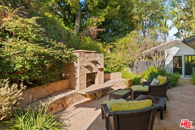 a backyard of a house with outdoor seating