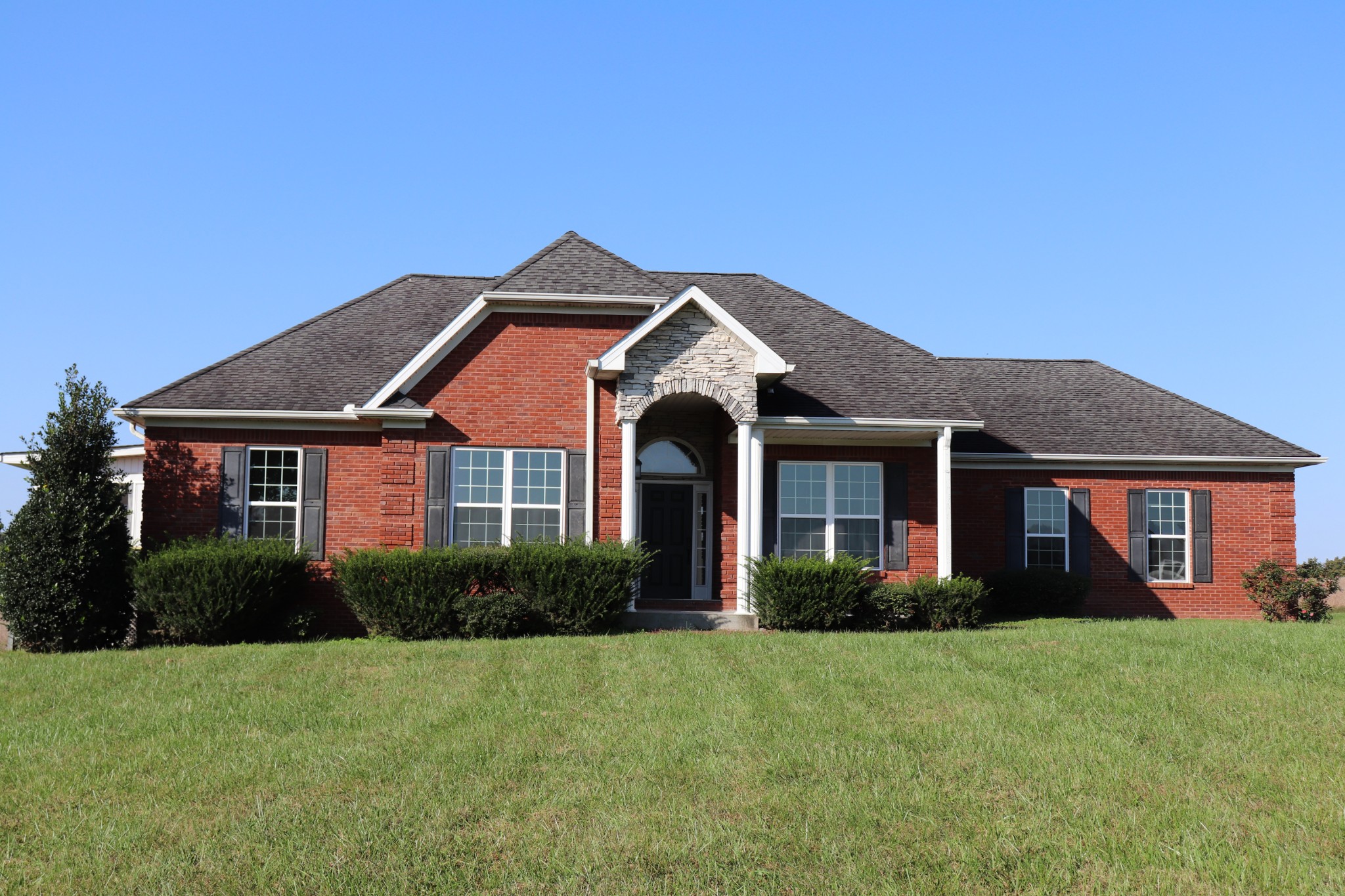 1180 Coleytown Road Lafayette, TN 37083 - Photo 2 of 42 a front view of a house with garden