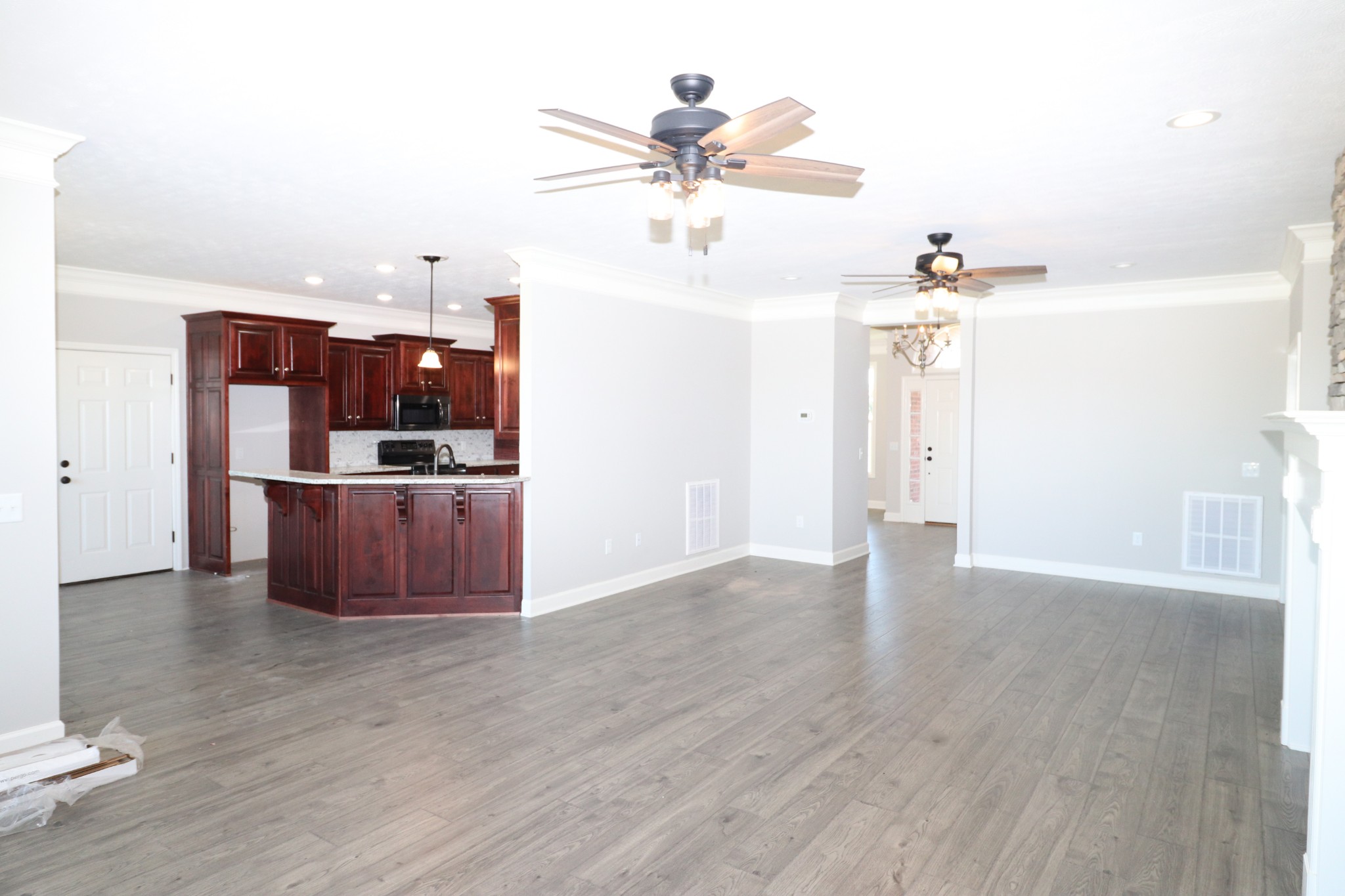 1180 Coleytown Road Lafayette, TN 37083 - Photo 11 of 42 a view of a kitchen with a sink a refrigerator and wooden floor