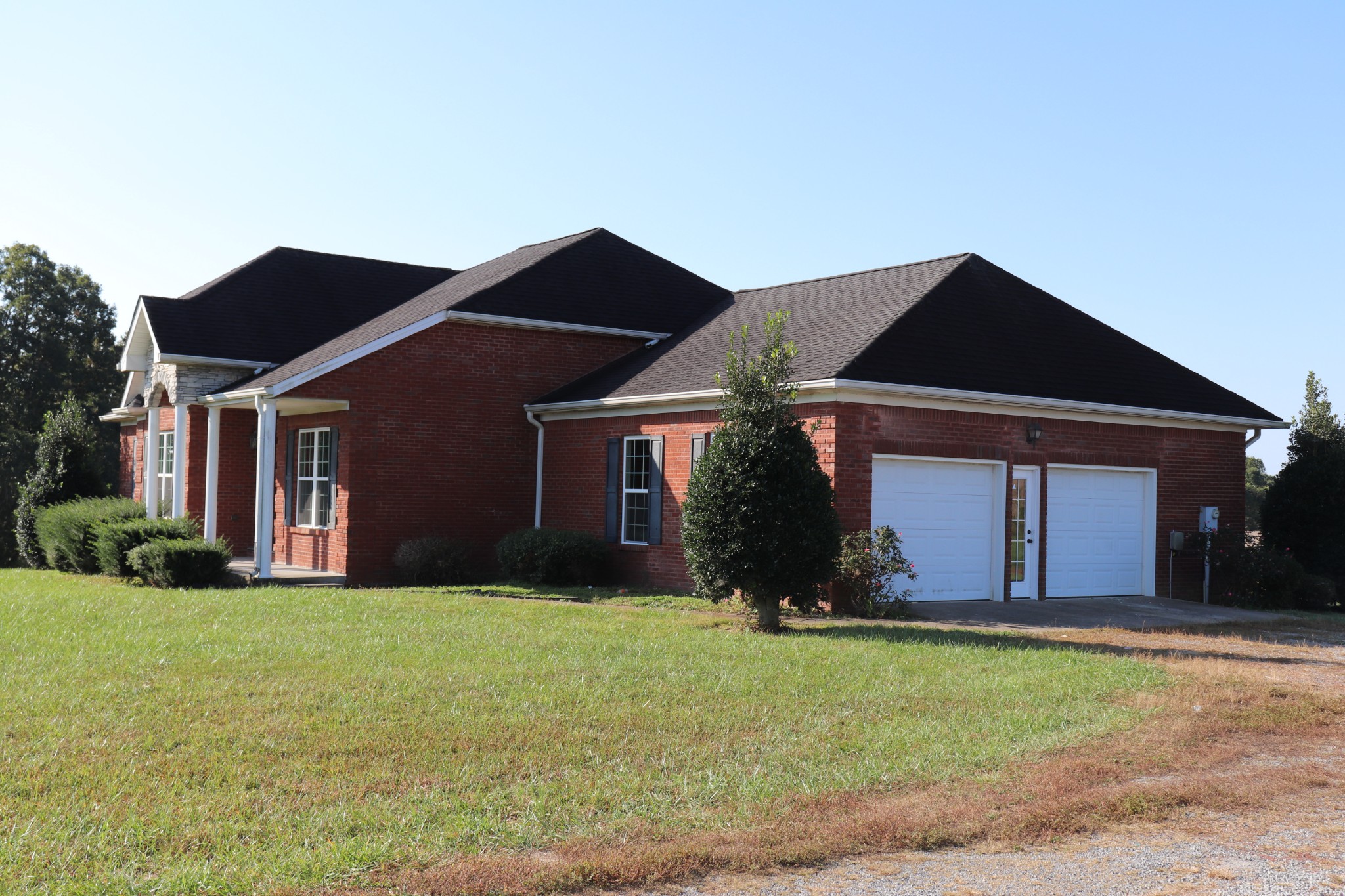 1180 Coleytown Road Lafayette, TN 37083 - Photo 3 of 42 a front view of house with yard and garage