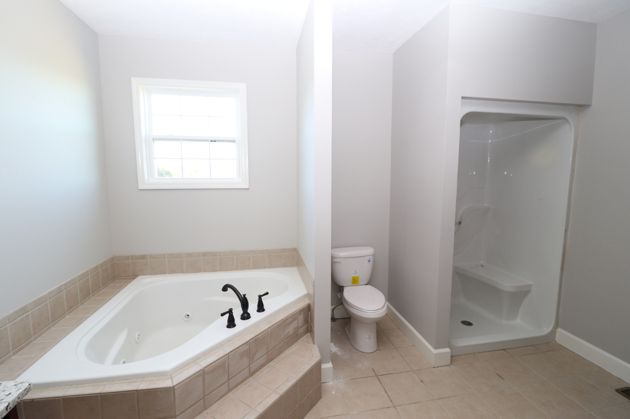 1180 Coleytown Road Lafayette, TN 37083 - Photo 21 of 42 a bathroom with a bathtub a toilet and a sink