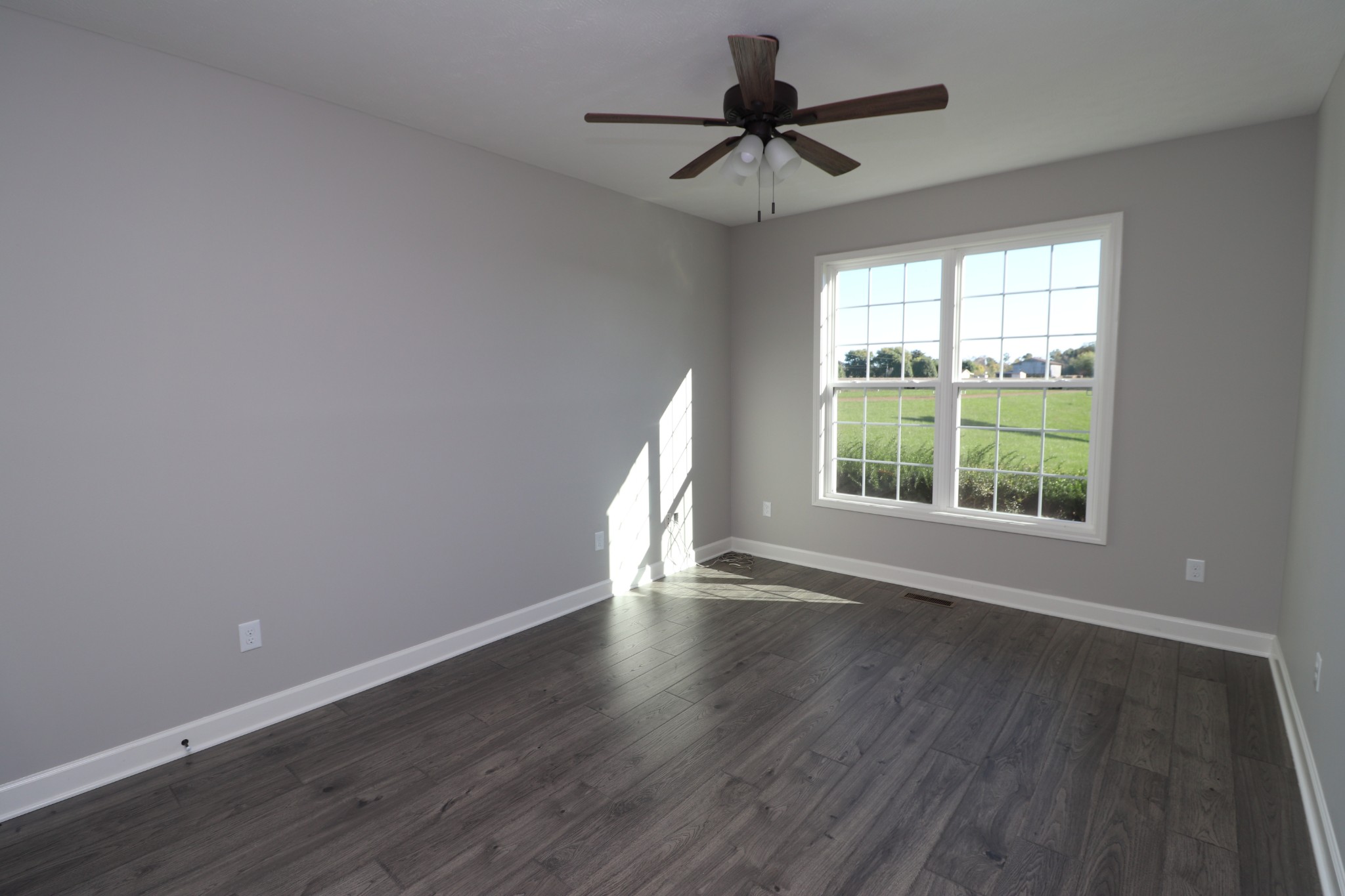 1180 Coleytown Road Lafayette, TN 37083 - Photo 29 of 42 a view of wooden floor and a chandelier fan in a room