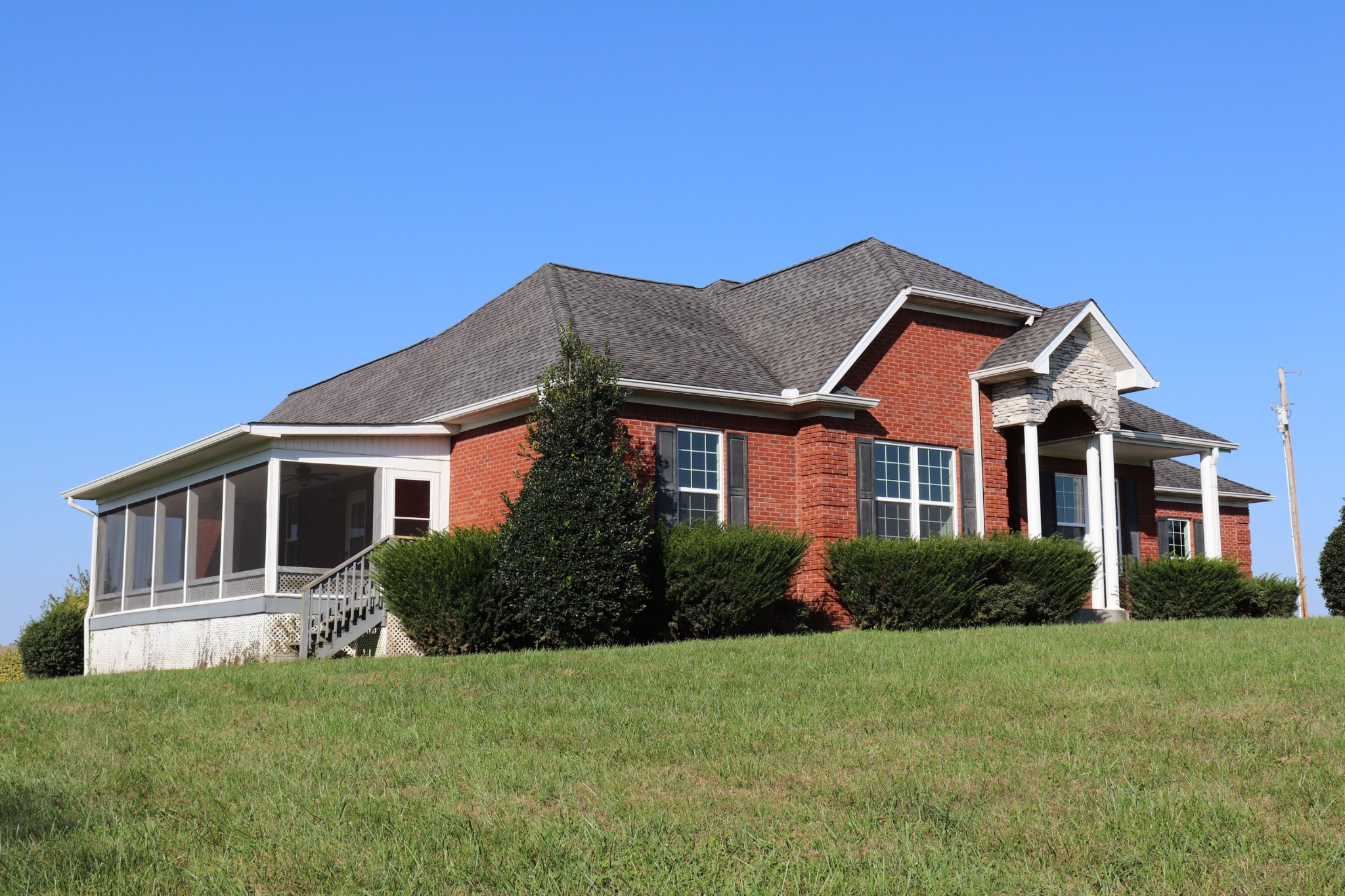 1180 Coleytown Road Lafayette, TN 37083 - Photo 4 of 42 a front view of a house with a garden