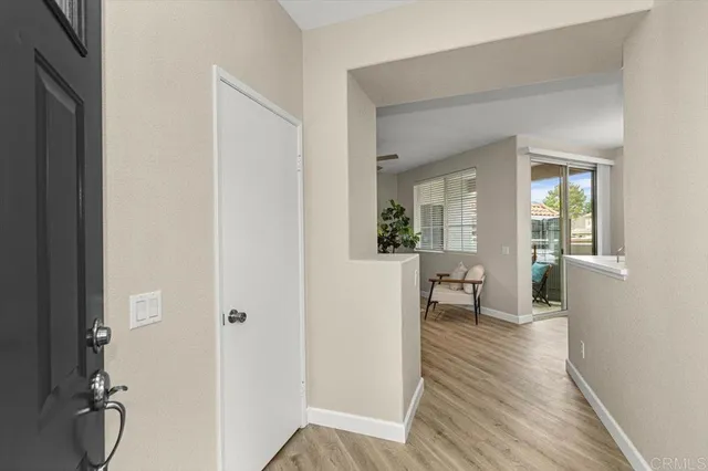 a view of a living room with windows