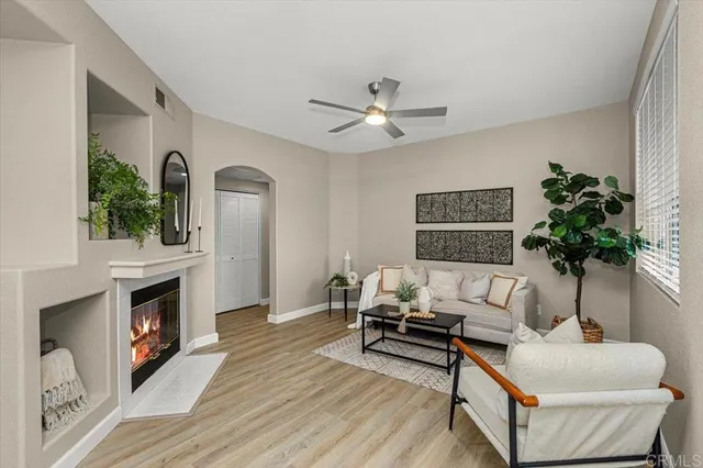a living room with furniture and a fireplace