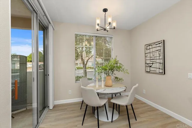 a view of a dining room with furniture and window