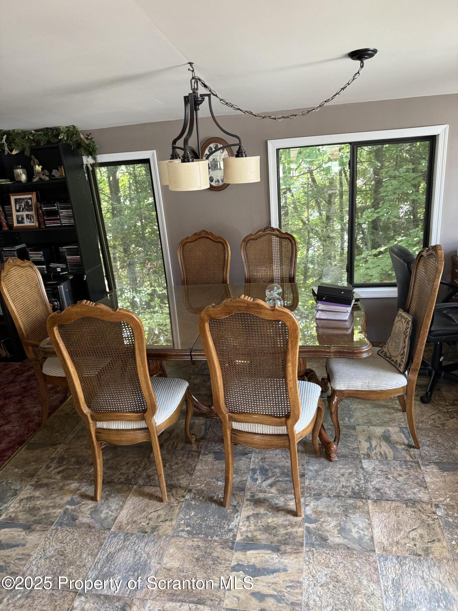 115 Taroli Street, Unit L20 22 Old Forge, PA 18518 - Photo 7 of 23 a living room with furniture and a large window
