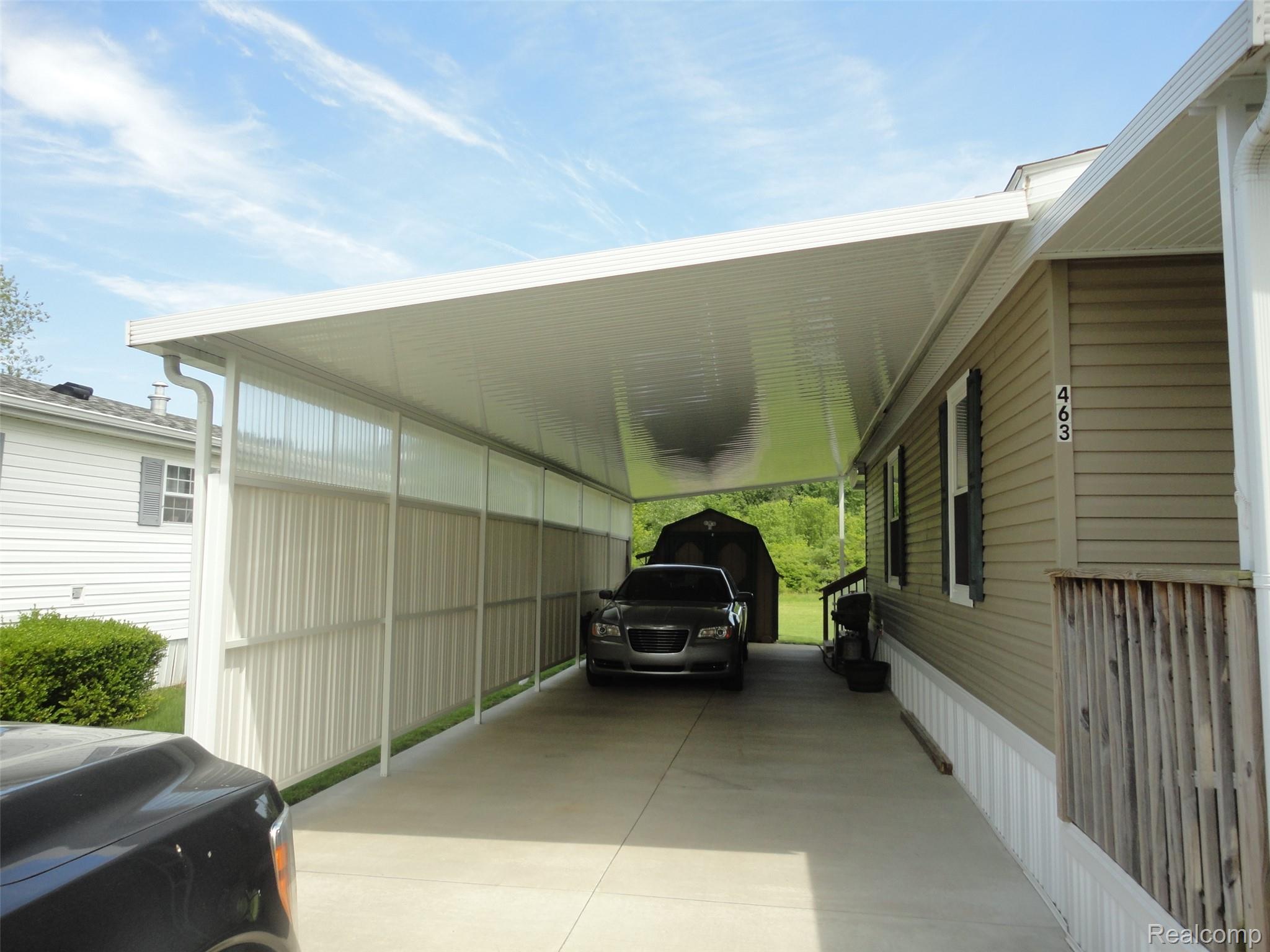 463 Edinborough Temperance, MI 48182 - Photo 16 of 23 Covered carport with a concrete driveway and an attached aluminum roof