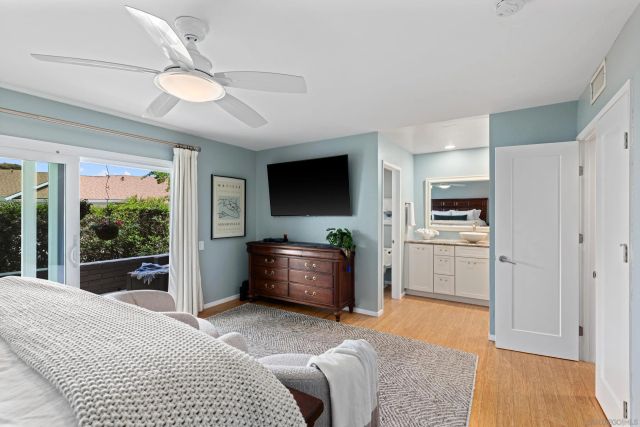 a bedroom with furniture and a flat screen tv