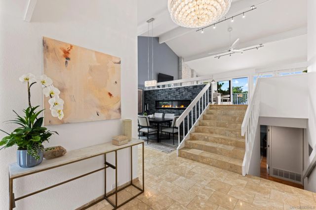 a hallway with a potted plant on a shelf and a potted plant