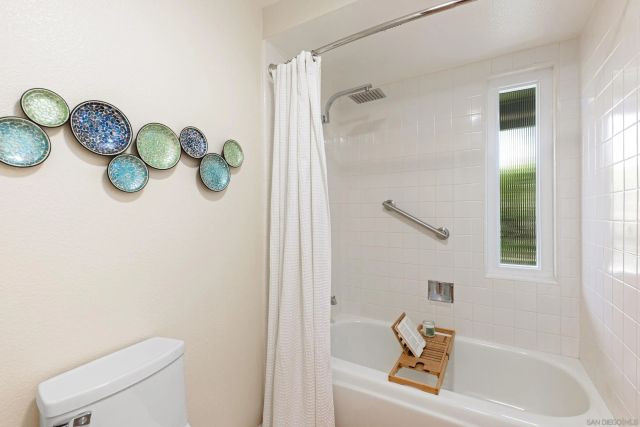 a bathroom with a sink a toilet and a bathtub