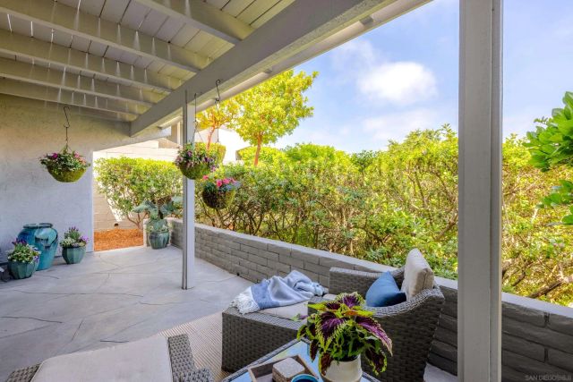 a view of a chairs and table in a patio