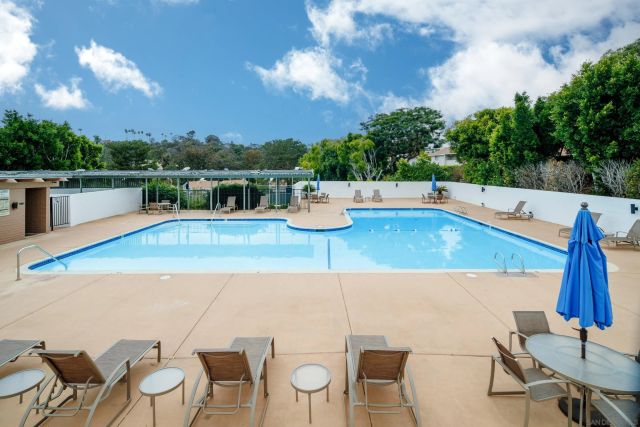 an aerial view of a house with pool table and chairs