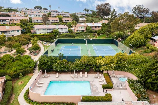 a view of a swimming pool with a patio