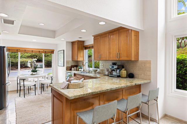 a kitchen with a stove a sink and a refrigerator