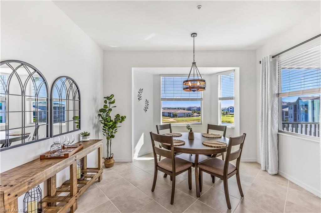 43989 Boardwalk Loop, Unit 2046 Babcock Ranch, FL 33982 - Photo 4 of 12 a dining room with furniture window and wooden floor