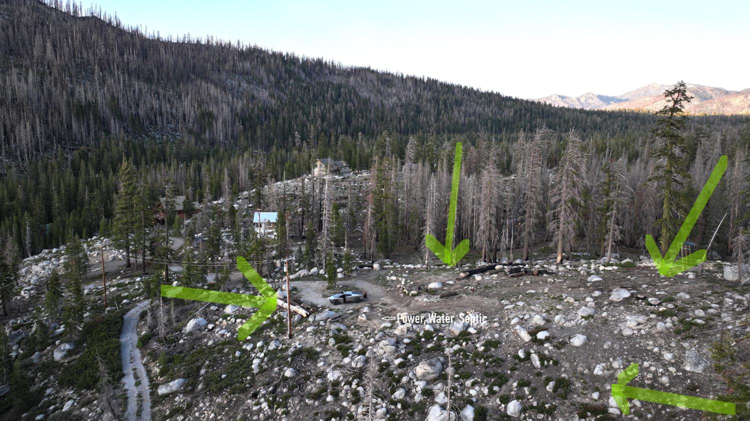 2080 Huckleberry Heights Road Twin Bridges, CA 95735 - Photo 8 of 28 a view of a backyard with plants and a wooden fence