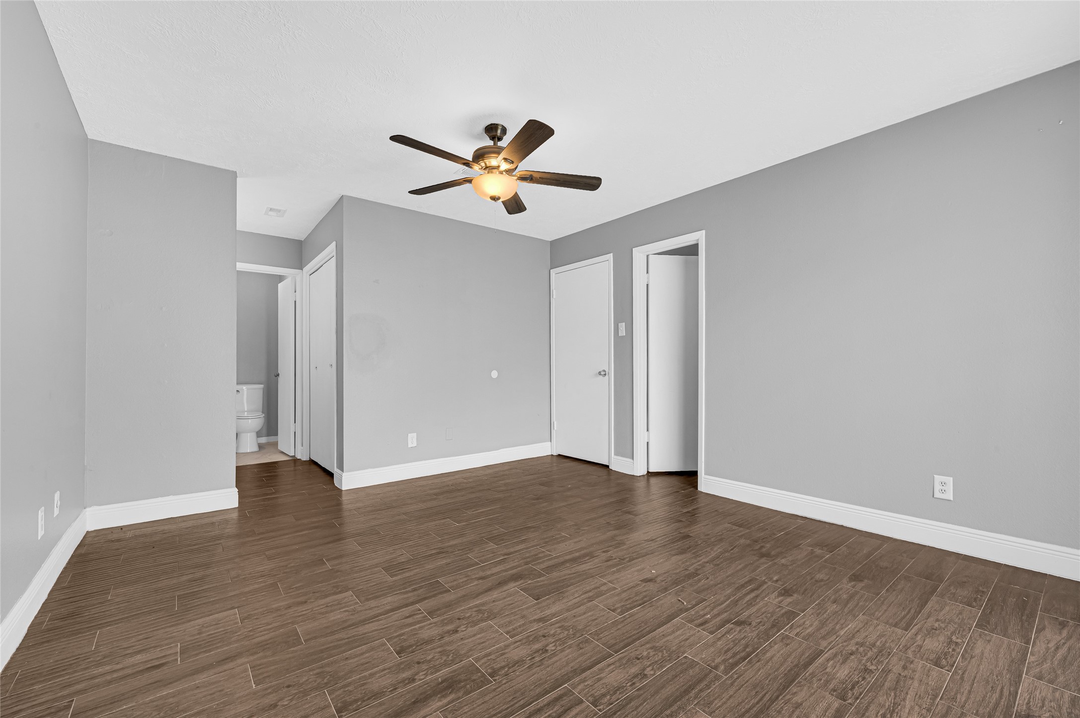 4170 Amir Street Houston, TX 77072 - Photo 10 of 18 a view of an empty room with wooden floor