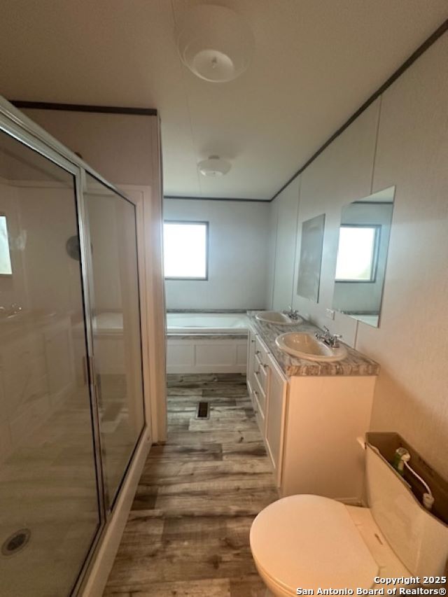 13 Green Meadows Knippa, TX 78870 - Photo 11 of 14 a bathroom with a sink toilet and shower