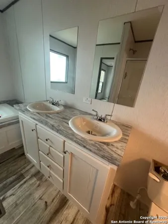 a bathroom with a sink and a mirror