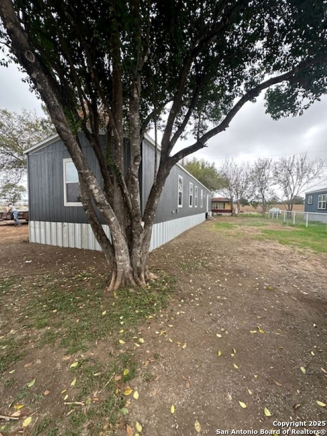 13 Green Meadows Knippa, TX 78870 - Photo 2 of 14 a backyard of a house with lots of green space