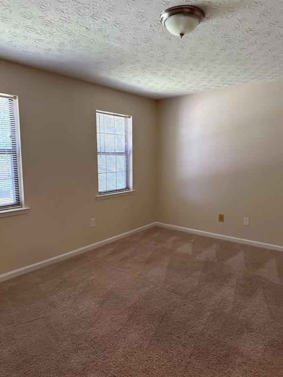 5956 North Castlegate Drive Atlanta, GA 30349 - Photo 11 of 28 an empty room with a workbench